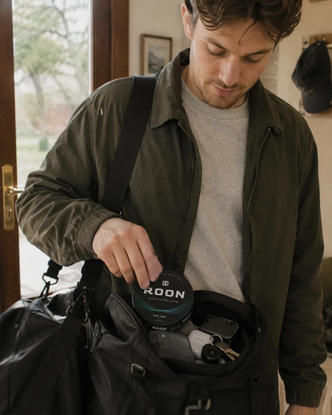 Slipping a tin of Roon into a bag on the way out the door