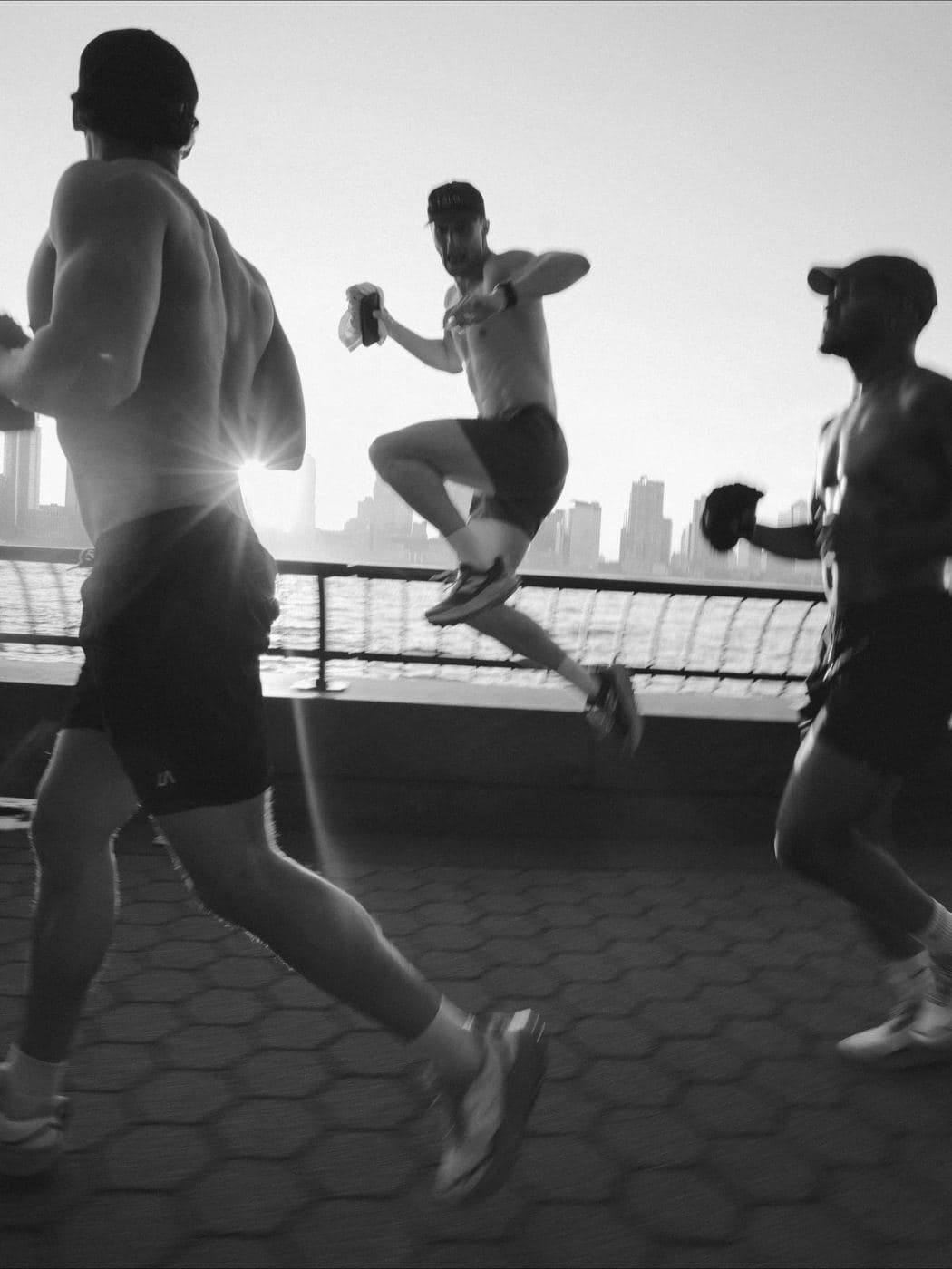 Black-and-white runners pushing pace, pre-workout focus