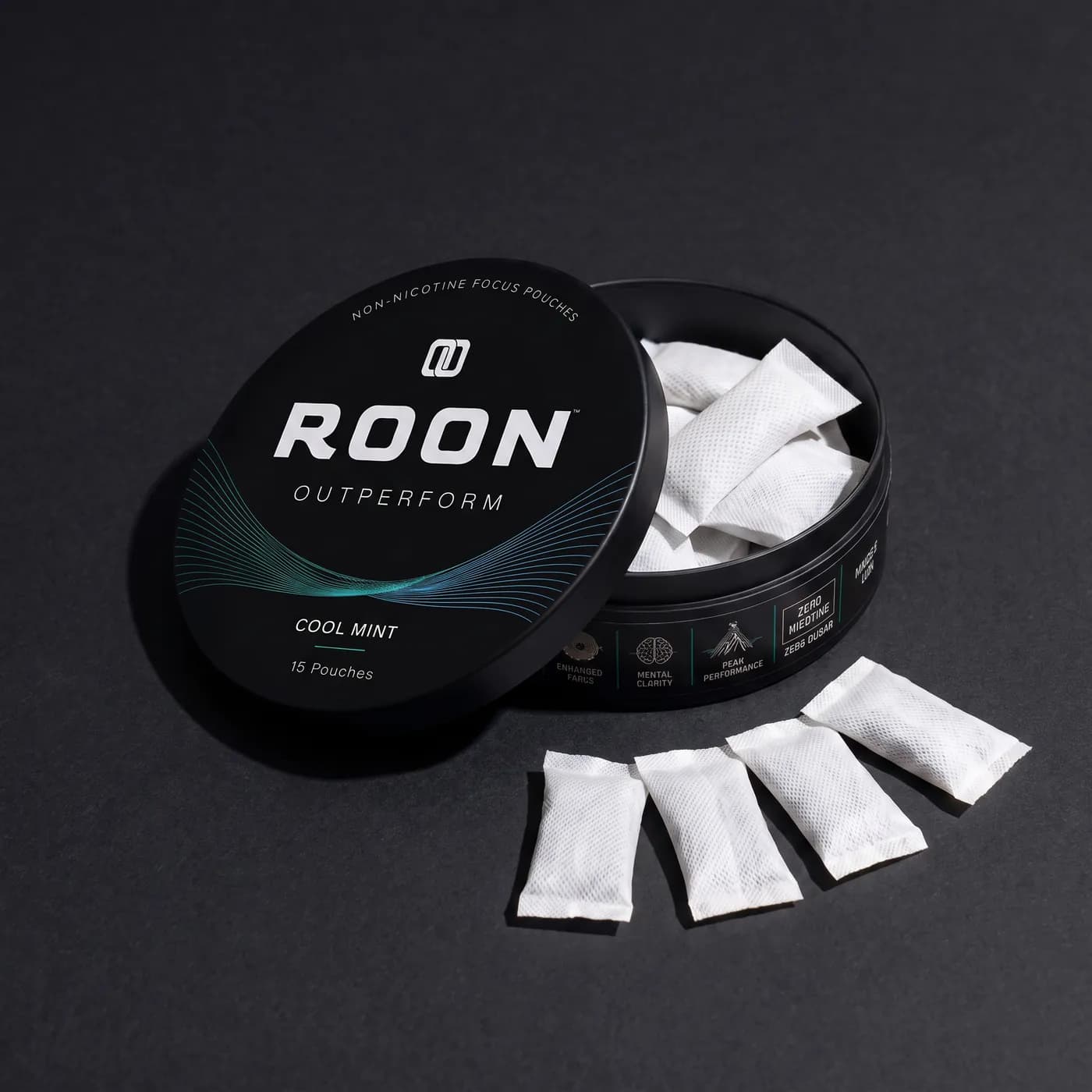 An open tin of Roon Cool Mint with four pouches fanned beside it, labelled with the caffeine, L-theanine, Dynamine and TeaCrine amounts per pouch.