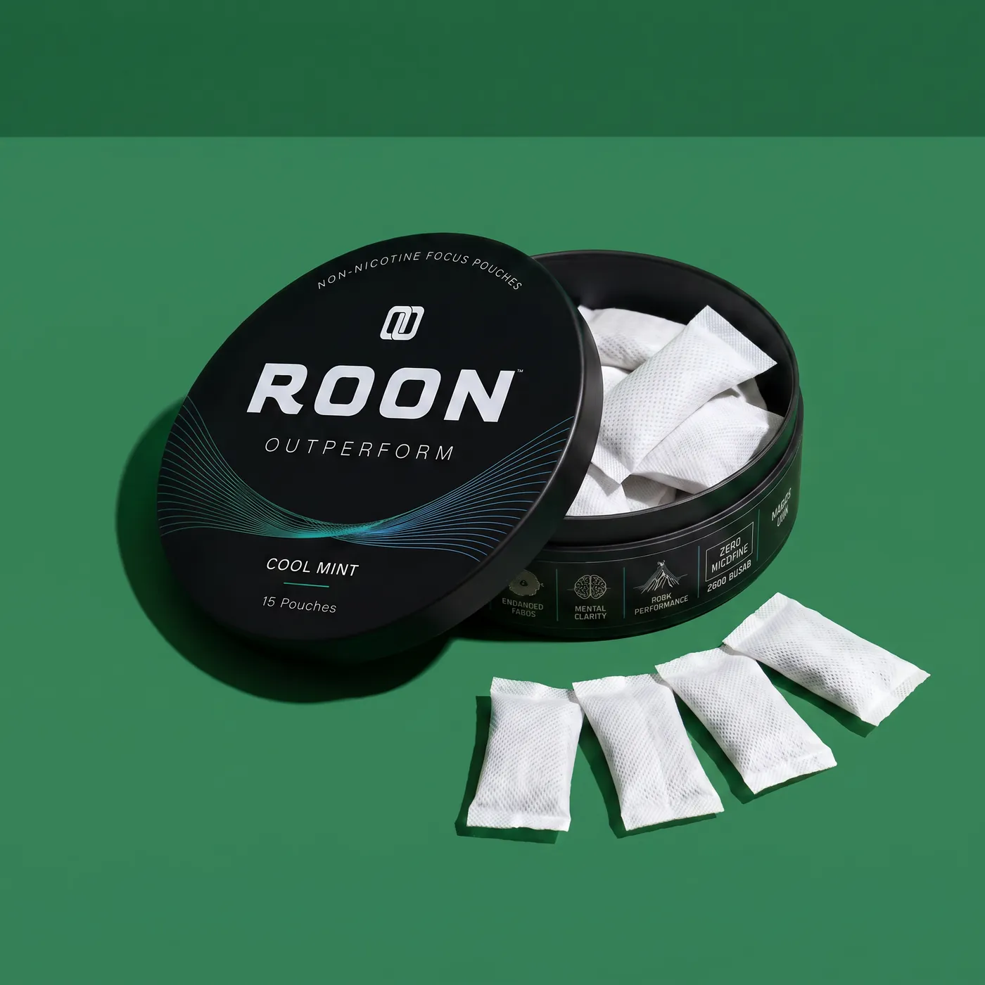 An open tin of Roon Cool Mint with four pouches fanned beside it, labelled with the caffeine, L-theanine, Dynamine and TeaCrine amounts per pouch.