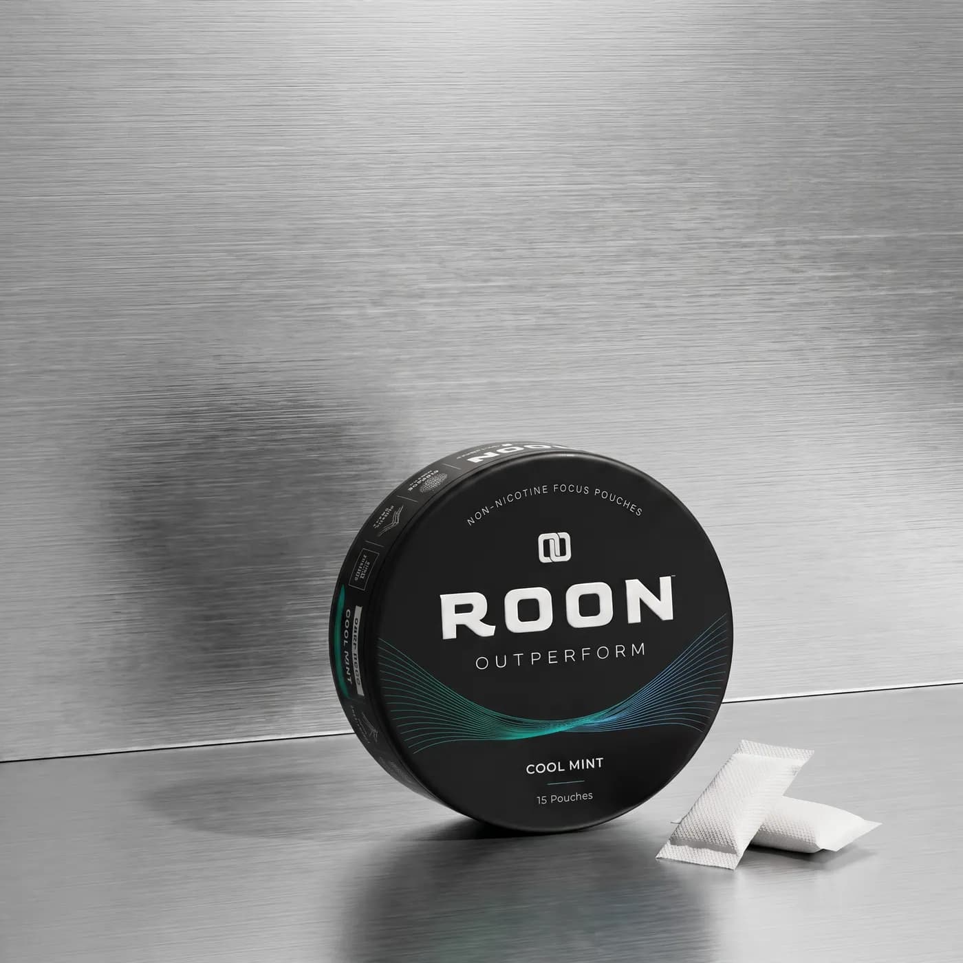 A closed tin of Roon Cool Mint pouches beside a sheet showing third-party testing and manufacturing details.