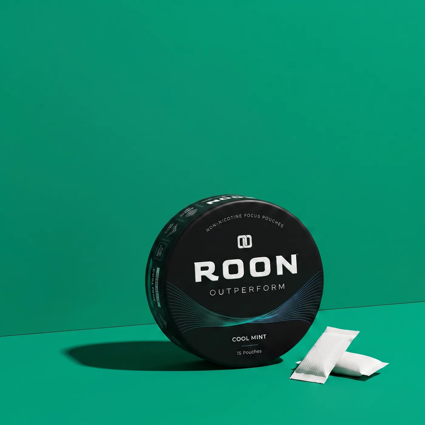 A closed tin of Roon Cool Mint pouches beside a sheet showing third-party testing and manufacturing details.