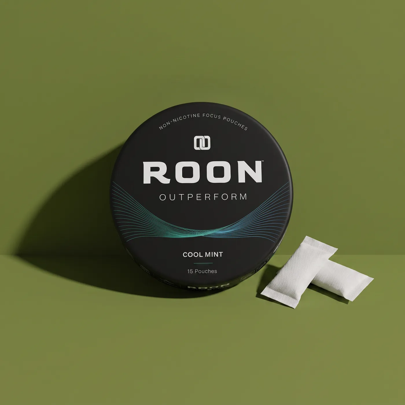 A closed tin of Roon Cool Mint pouches held flat in an open palm, showing its pocket size.