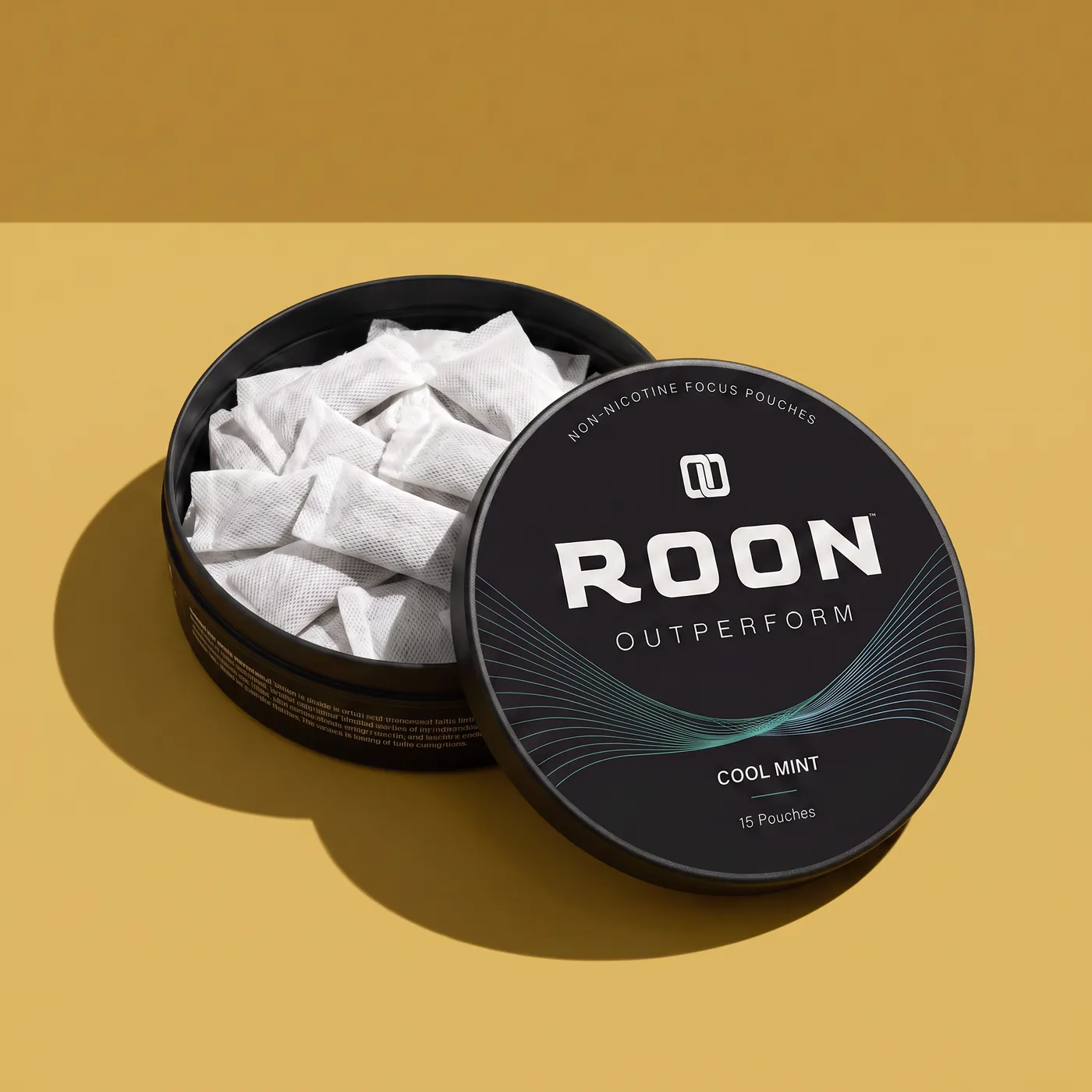 An open tin of Roon Cool Mint pouches on a windowsill in bright low-angle seasonal sunlight.