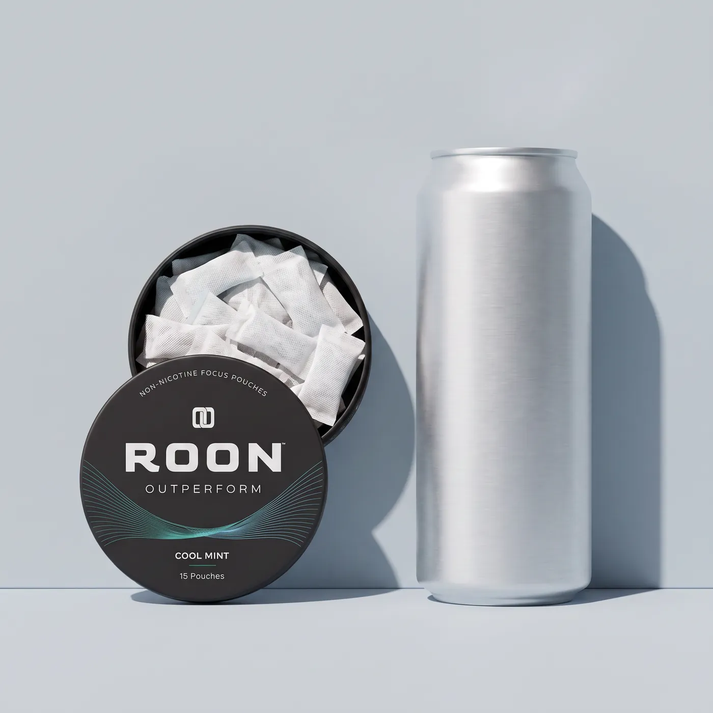 An open tin of Roon caffeine pouches in front of a plain slim energy drink can, comparing the two formats.