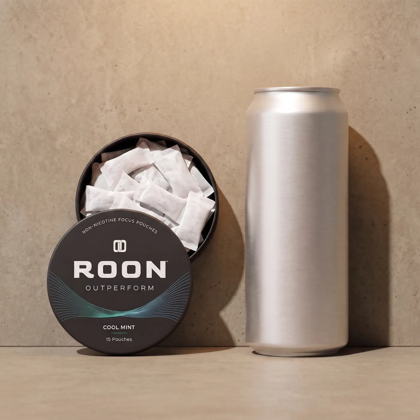 An open tin of Roon caffeine pouches in front of a plain slim energy drink can, comparing the two formats.