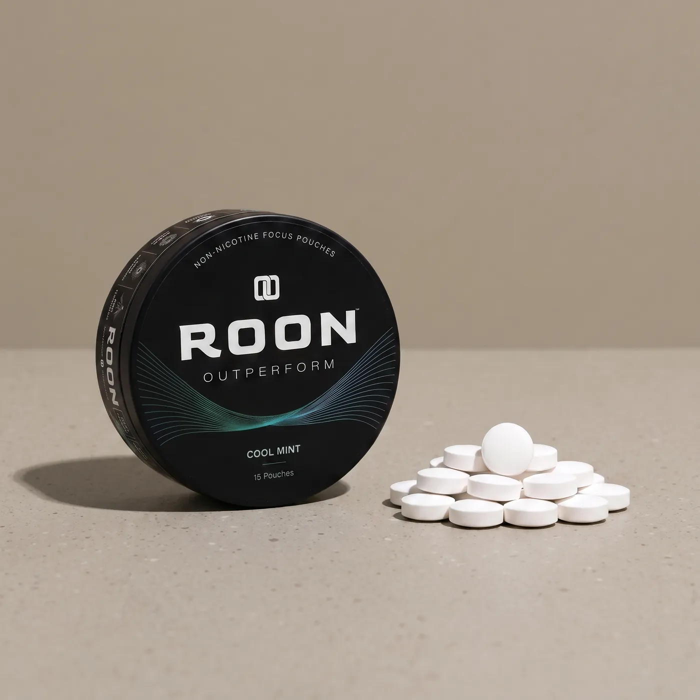 An open tin of Roon caffeine pouches next to loose caffeine tablets, comparing the two formats.