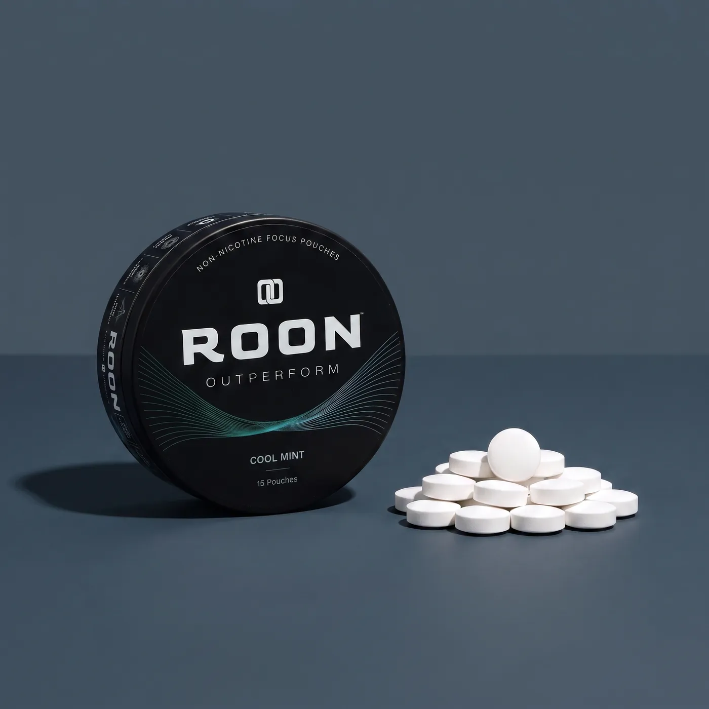 An open tin of Roon caffeine pouches next to loose caffeine tablets, comparing the two formats.