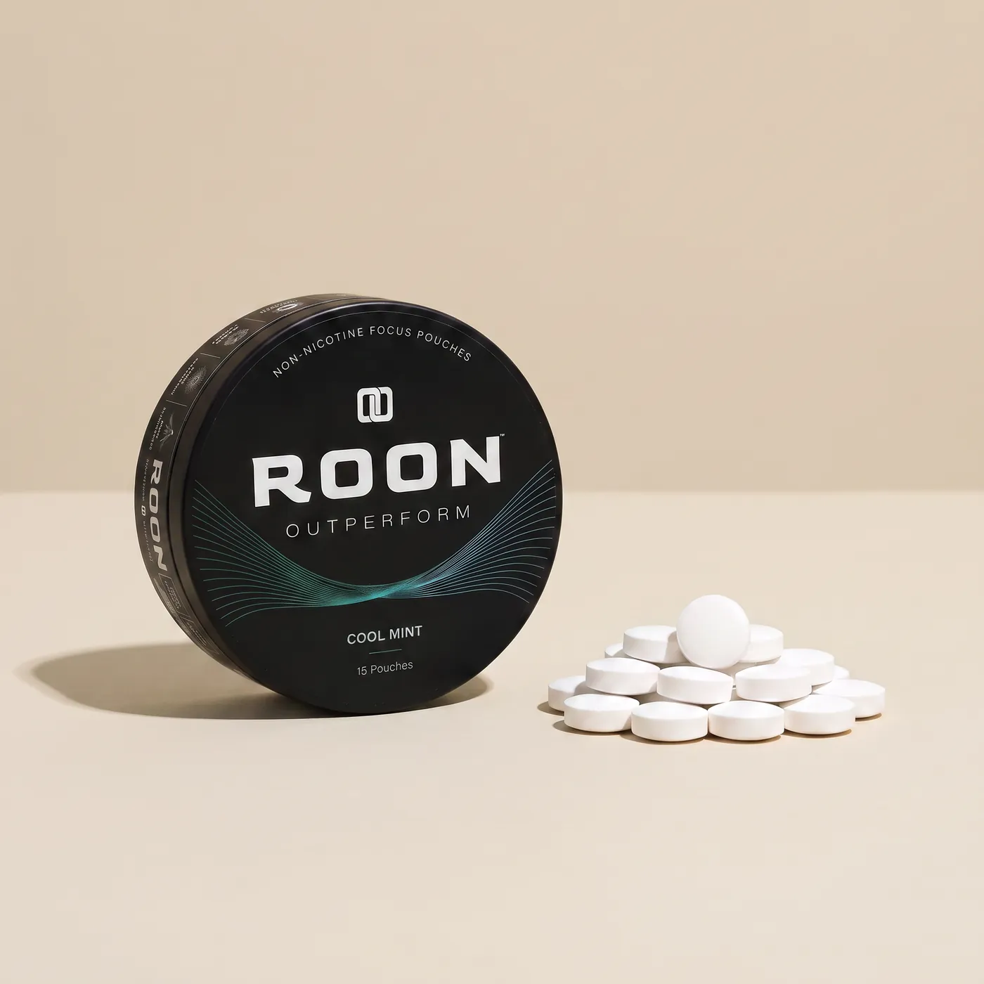 An open tin of Roon caffeine pouches next to loose caffeine tablets, comparing the two formats.