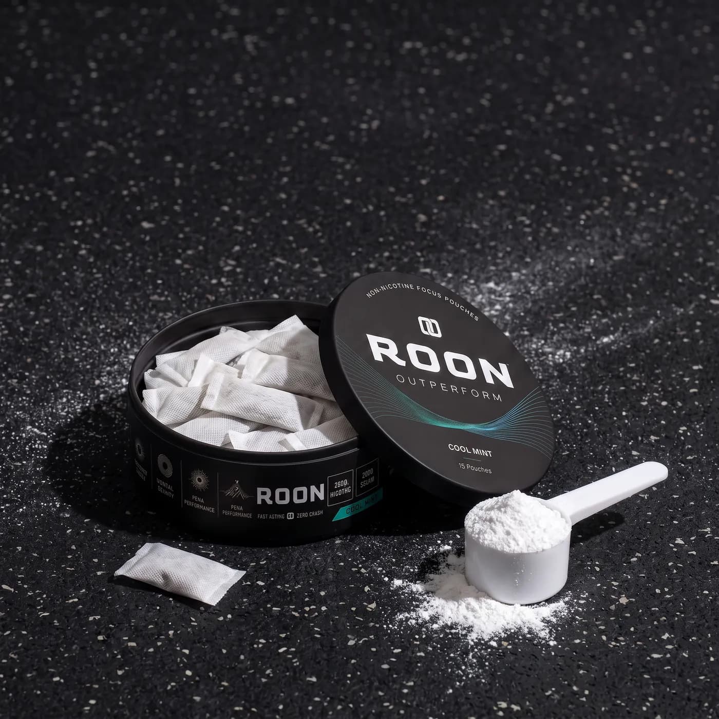 An open tin of Roon caffeine pouches beside a scoop of pre-workout powder, comparing the two formats.