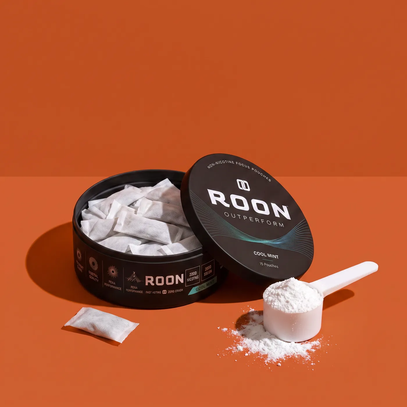 An open tin of Roon caffeine pouches beside a scoop of pre-workout powder, comparing the two formats.
